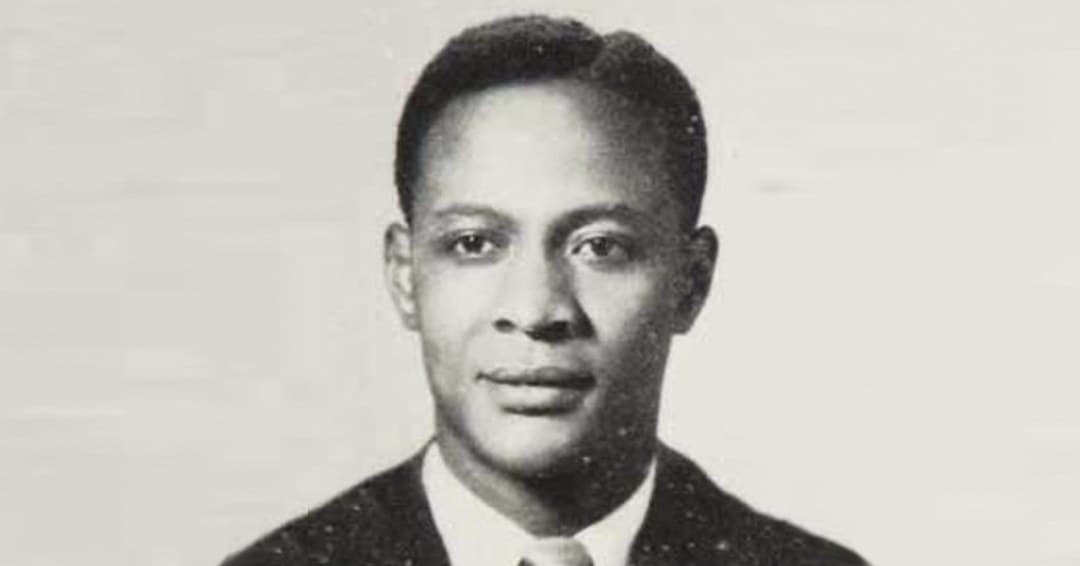 Black-and-white portrait of Dr. Joseph "Al" Liverpool: a man in a dark jacket, white shirt and tie, looking at the camera